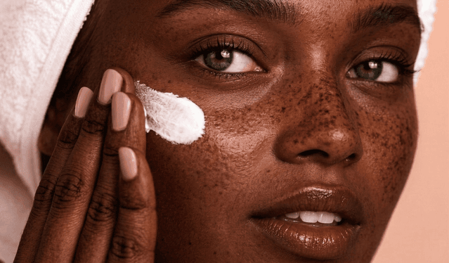 Woman applying skincare